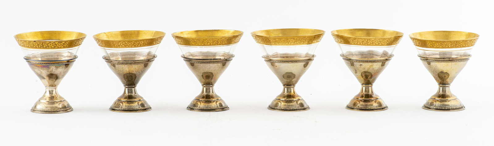 Sterling Silver and Gilt Glasses, 6: Set of six sterling silver and gilt glasses, marked "Sterling," silver weighs 3.21 ozt. Provenance: Removed from a private residence furnished by James Mont at 370 East 76th Street.