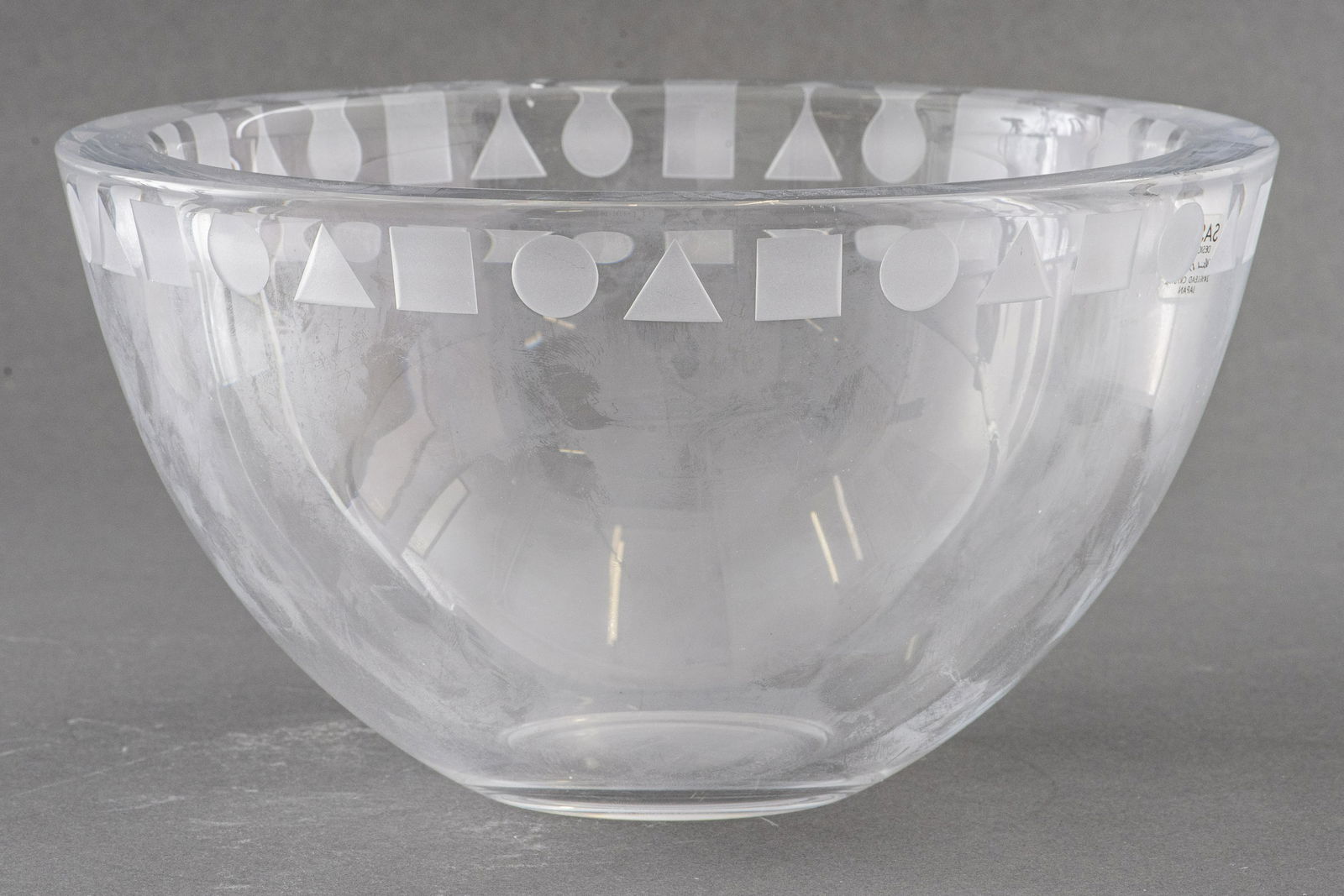 Ward Bennett for Sasaki Geometric Crystal Bowl: Ward Bennett for Sasaki geomatric crystal glass large bowl, made in Japan, marked "Sasaki / Designed by / Ward Bennett / 24% Lead Crystal / Japan." 4.75" H x 8.75" in diameter