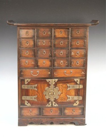 Korean Wood Medicine Chest Early 20th C.: Formally appraised, twenty-one drawers make up this home version of a Korean doctor's medicine chest. The characters indicate the contents, such as roots and wildflowers. The main chamber opens to exp