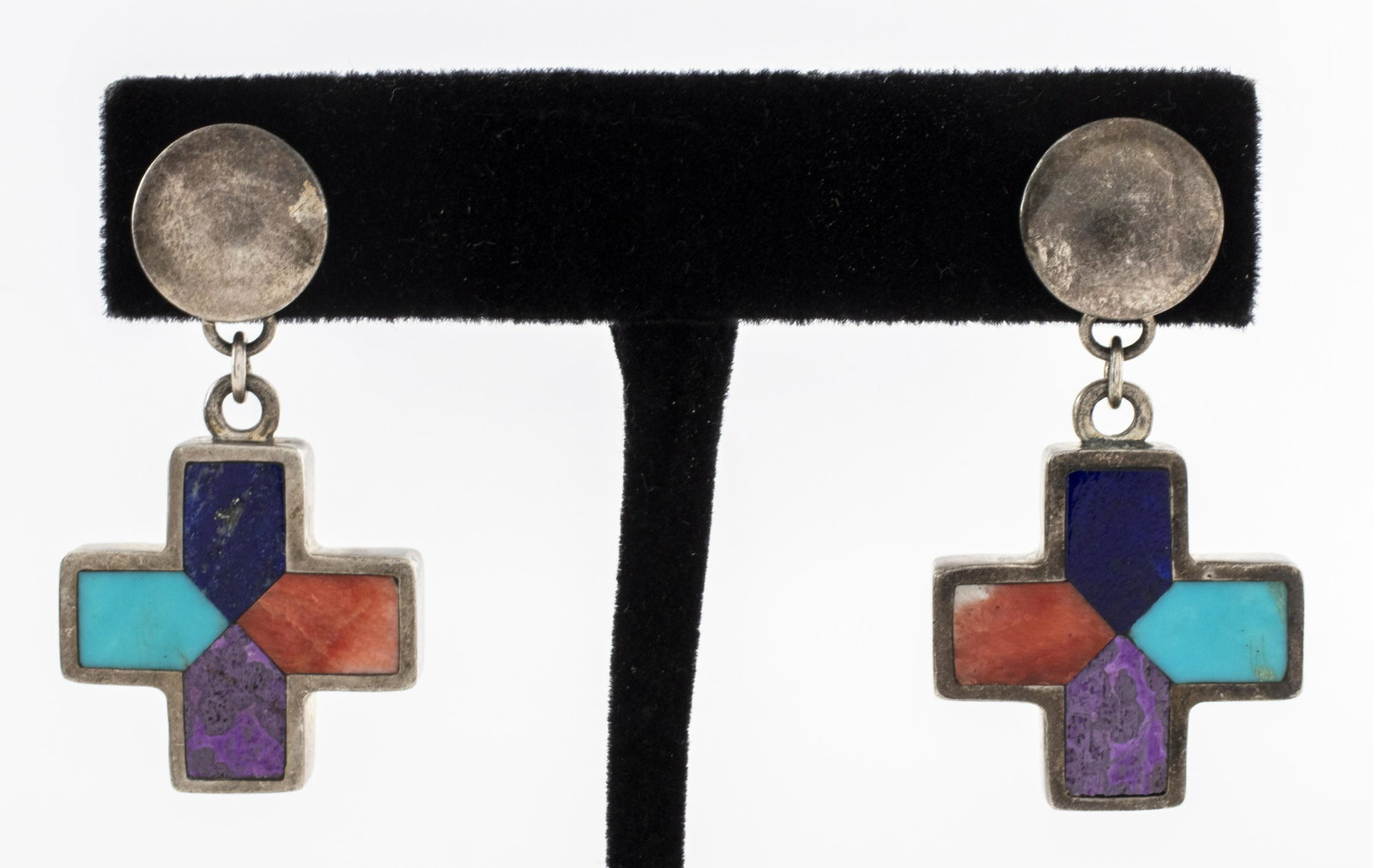 Christin Wolf Silver Colored Stone Inlay Earrings: Christin Wolf sterling silver colored stone inlay cross motif drop post earrings, inlayed with turquoise, lapis lazuli, orange spiny oyster and sugilite stones. Marked: " . CHRISTIN." Earrings: 1.50"L