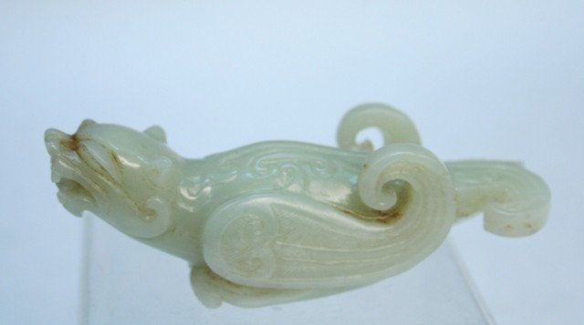 Chinese He-Tian Carved Jade Brush Rest: Carved he-tian jade brush rest of a winged creature, China; unmarked. Dimensions: 1-1/4"H x 3-1/2"W x 1-1/8"D
