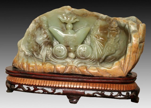 Chinese Green and Brown Jade Archaic Design: Carved jade in brown and green tones with archaic motif, China; unmarked. Dimensions: 7-1/2"H x 11"W x 4-1/2"D