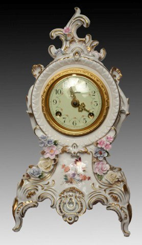 Porcelain Gilded Floral Clock Haynes Face Dresden: Porcelain clock adorned in flowers, with Haynes face, possibly Dresden; Dresden RK mark. Dimensions: 14-1/4"H x 7-1/2"W x 5"D