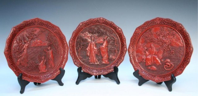 Chinese Cinnabar & Copper Lacquer Plates 20th C.: Three finely carved cinnabar lacquer plates mounted on copper base, all with figural scene, China, twentieth century; marked. Dimensions: 9-5/8" diameter