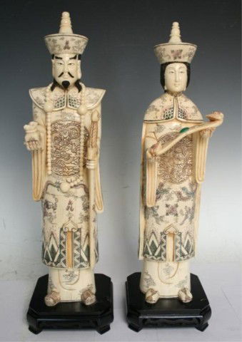 Pair of Chinese Ivory/Bone King & Queen Sculptures: Pair of finely-carved, painted sculptures depicting a king and queen with an inlaid jade stone, ivory or bone, China; unmarked. Dimensions: King 20-3/4"H x 6"W x 5-1/2"D; Queen 20-1/2"H x 6"W x 5-1/2"