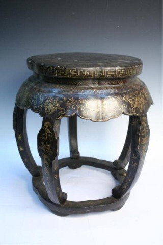 Chinese Black Wood Lacquered Garden Stool 18th C.: Black lacquered wooden garden stool with gilt inlays with floral motif, eighteenth century, China; unmarked. Dimensions: 18-1/4"H x 17-1/4"W; seat 14"W