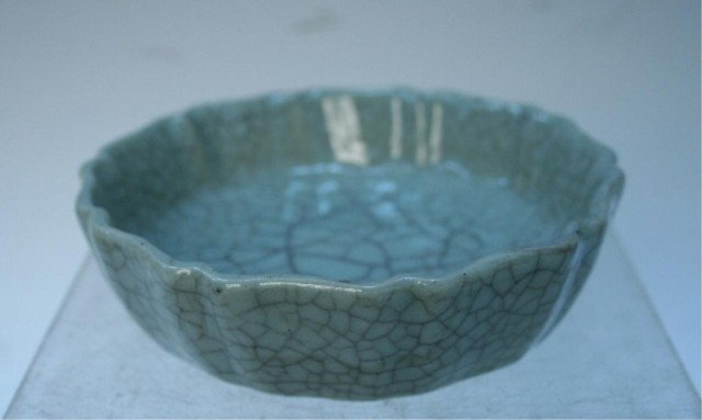 Chinese Green Porcelain Brush Washer Craquelure: Green circular porcelain brush washer with high-gloss finish and craquelure throughout, China; marked. Dimensions: 1-1/4" deep, 4-3/8" diameter
