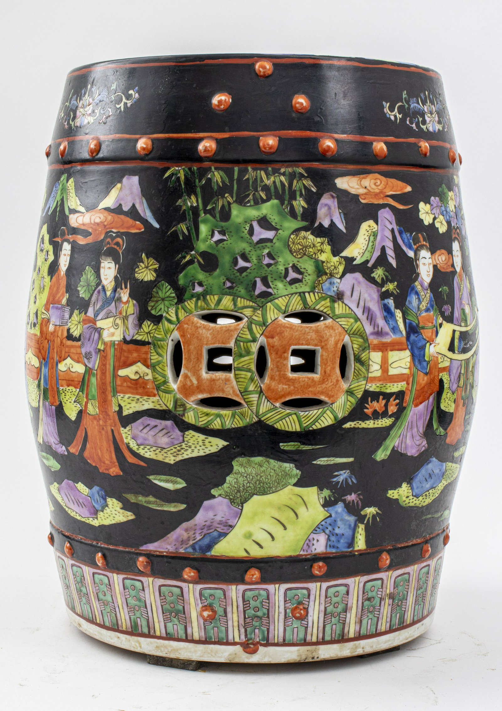 Chinese Famille Noir Porcelain Garden Seat: Barrel form with pierced coin elements and painted with figures in a garden setting, 20th century, 19" X 14" diameter.