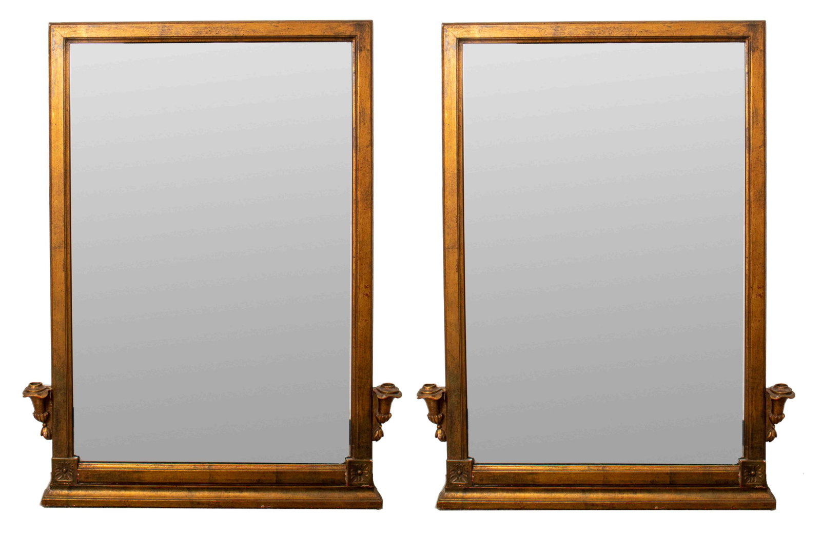 George III Style Giltwood Girandole Mirrors, Pair: Pair of English giltwood girandole mirrors carved with vignettes of roses near base and with two candle holders jutting out from the frame, in the style of George III. 34.5" H x 27" W x 1.8" D.