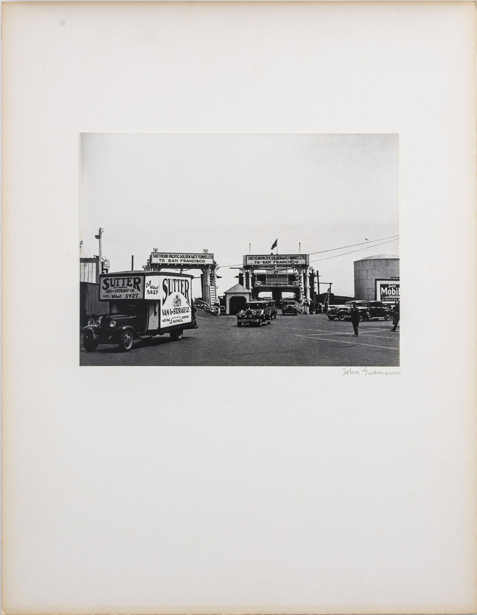 John Gutmann "Auto Ferries" Gelatin Silver Print: John Gutmann (German-American, 1905-1998) "Auto Ferries, Sausalito Exit, California," gelatin silver print, 1934, printed in 1974, signed in pencil on board mount, bearing Martin Z. Margulies Collecti
