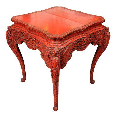 Chinese Carved Cinnabar Lacquer Table 19th C.: Center table with Greek key border, intricately carved clouds and winged dragons adorning cabriole legs and scalloped apron, cinnabar lacquered hardwood, China, nineteenth century; unmarked. Dimension