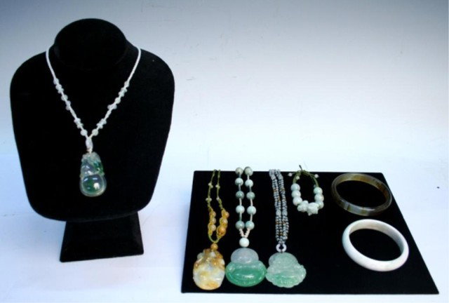 Various Chinese Jade Jewelry Necklaces & Bracelets: Lot includes two jade bangles, one beaded adjustable jade bracelet, and four adjustable jade pendant necklaces featuring Buddha, China; unmarked. Dimensions: White jade bangle 1/4" thick, 2-7/8" diame