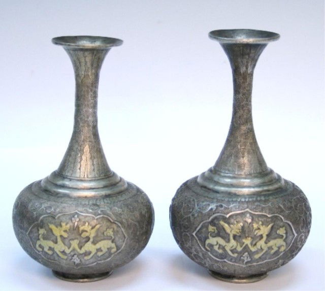 Pair Chinese Tang Dynasty Gilded Vases: Pair of small vases with incised and low relief ornamentation, gilded gold, China, Tang Dynasty (618-907); each marked on bottom. Dimensions: Shorter 5-1/2"H x 3-1/2" diameter; taller 5-3/4"H x 3-1/2"