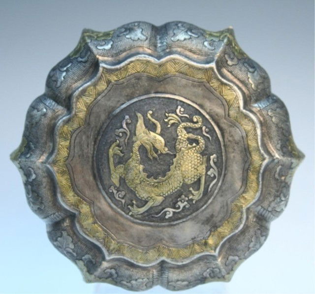 Chinese Tang Dynasty Gilded Round Dragon Box: Round box with incised floral motif around the body and a medallion in center of lid with dragon, gilded gold, China, Tang Dynasty (618-907); marked on bottom. Dimensions: 3"H x 6-1/8" diameter