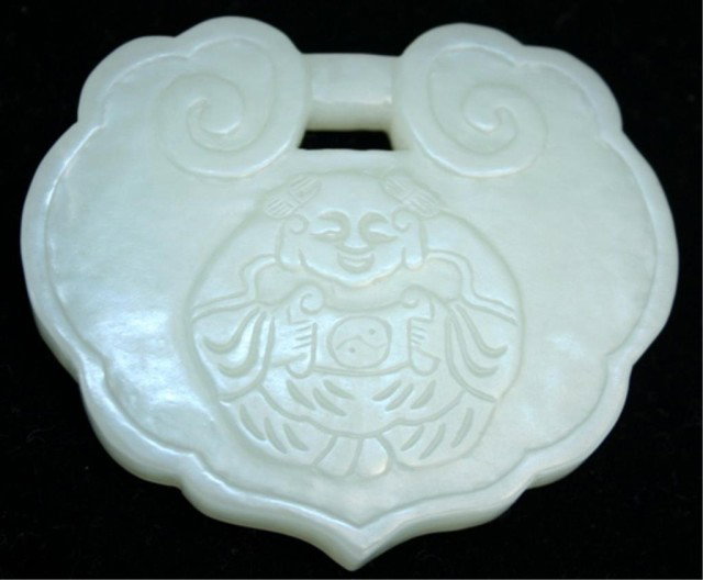 Chinese White Jade Carved Pendant: Leaf shaped white jade carved pendant, Buddhist figure on one side and calligraphy on reverse, China; marked. Dimensions: 2-1/8"H x 2-1/2"W
