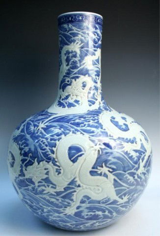 Large Chinese Porcelain Blue & White Dragon Vase: Large blue and white vase with low relief dragon motif, porcelain, China, twentieth century; marked on bottom. Dimensions: Approximately 21"H x 14-1/2" diameter Weight: 20lbs