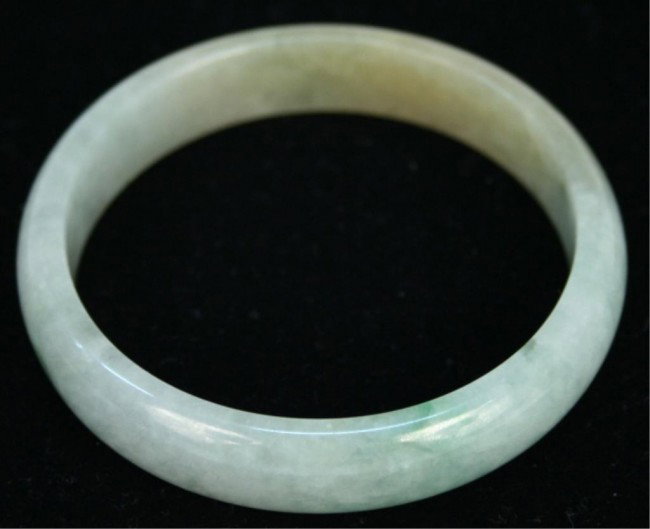 Chinese Mottled Green Jade Bangle: Mottled green jade bangle, China; unmarked. Dimensions: 1/2"H x 2-3/4" diameter