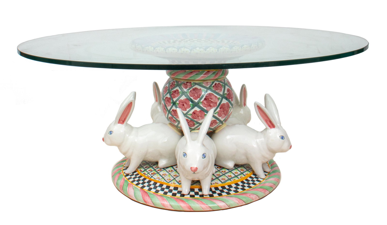 MacKenzie-Childs Glazed Ceramic "Rabbits" Table: MacKenzie-Childs modern glazed ceramic round table, hand painted with floral pattern, with a fluffle of five rabbits surrounding the base. 18" H x 42" diameter. Provenance: Removed from a West Palm Be