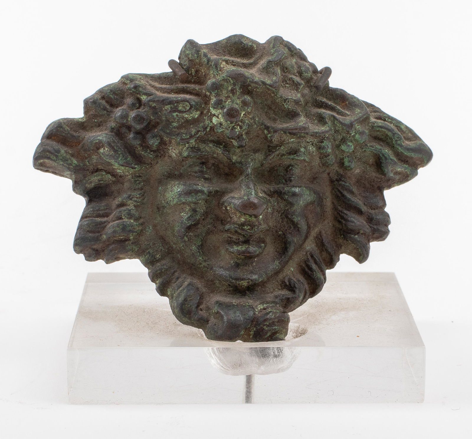 Patinated Bronze Masque of Bacchus: Patinated bronze masque of Bacchus (Dionysus) mounted upon a lucite stand, together with a Certificate of Antiquity from J. Zadok & Sons dating the artifact to before the Renaissance, 15th to 16th cen