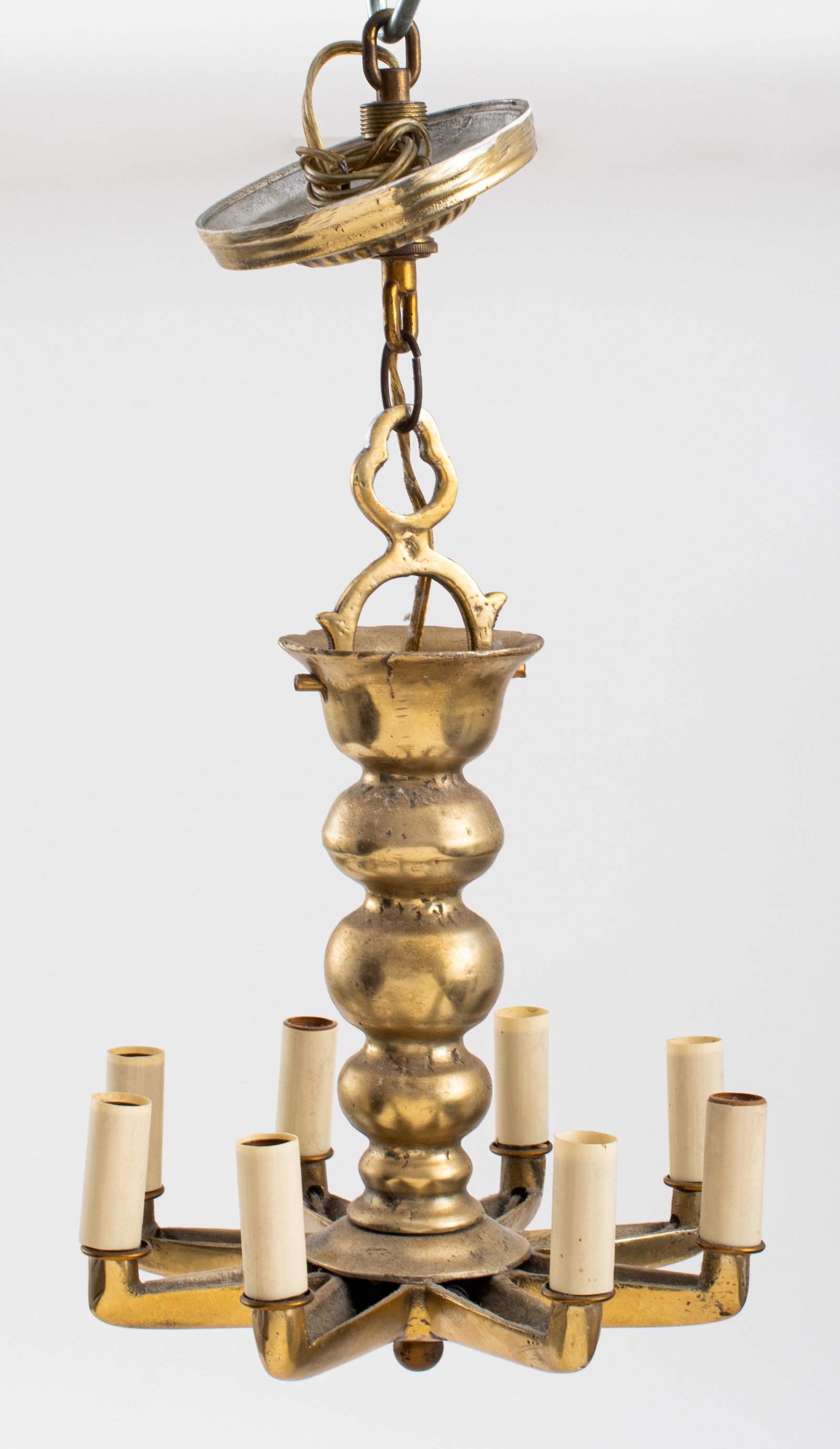 Art Moderne Brass Eight-light Star-Form Chandelier: Art Moderne Brass eight-light star-form chandelier with lobed central shaft with eight extruding arms with candleholders. 11" H x 9" diameter