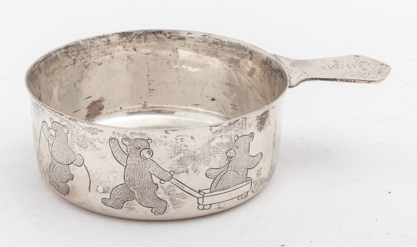 Tiffany Sterling Child's Porringer Bears: Tiffany sterling silver child's porringer with hand chased bears around the outside of the bowl roller skating, jumping rope and getting pulled in a wagon, handle engraved with the name "Remi," marked