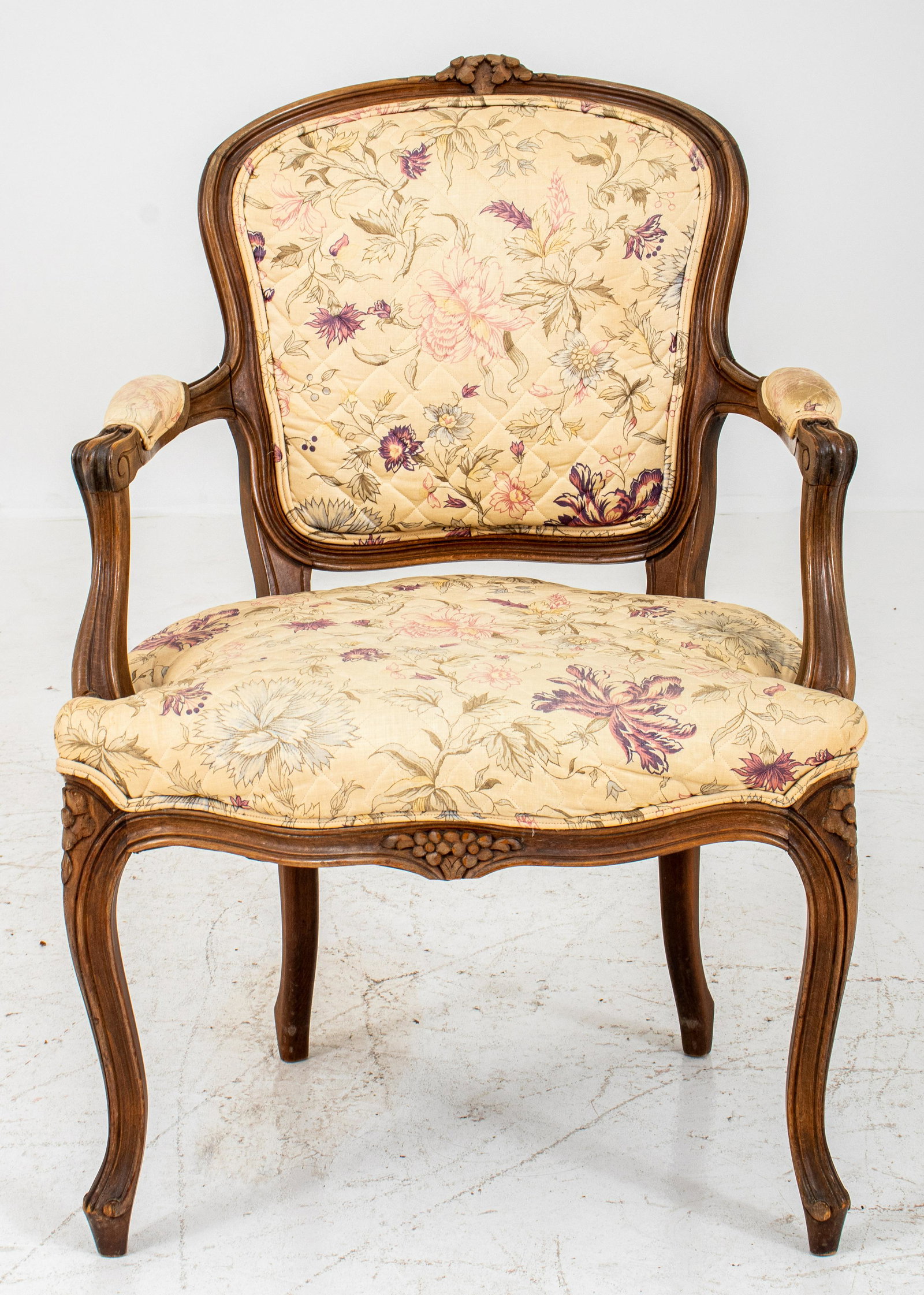 Louis XV Style Beechwood Open Arm Chair: Louis XV Style beechwood open arm chair or fauteuil en cabriolet, with floral headed shaped crestrail surmounting a gently curving back and scrolling open arms above a shaped seat on flower-headed cab