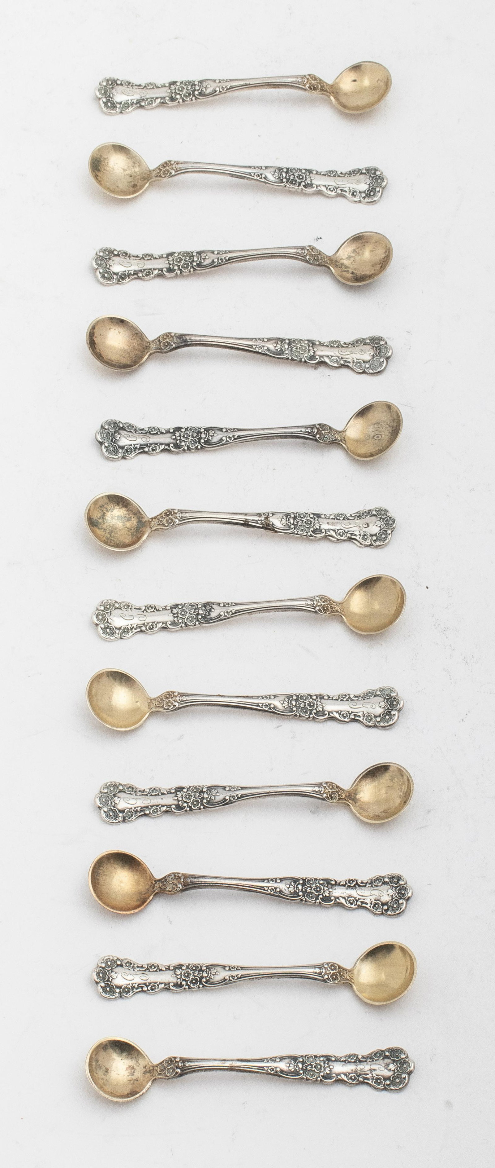 Gorham Sterling Buttercup Individual Salt Spoon,12: 12 Gorham sterling individual salt spoons with gold washed bowls in the floral Buttercup pattern which was introduced in 1899, monogrammed with "G," marked with Gorham's maker's mark and "Sterling." E