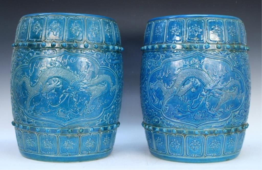 Chinese Blue Garden Stool Pair Qianlong Mark: Pair of blue glazed porcelain garden stools with dragon motif, China; Qianlong mark. Dimensions: each 17"H x 12-1/2" diameter; 27 lbs. each