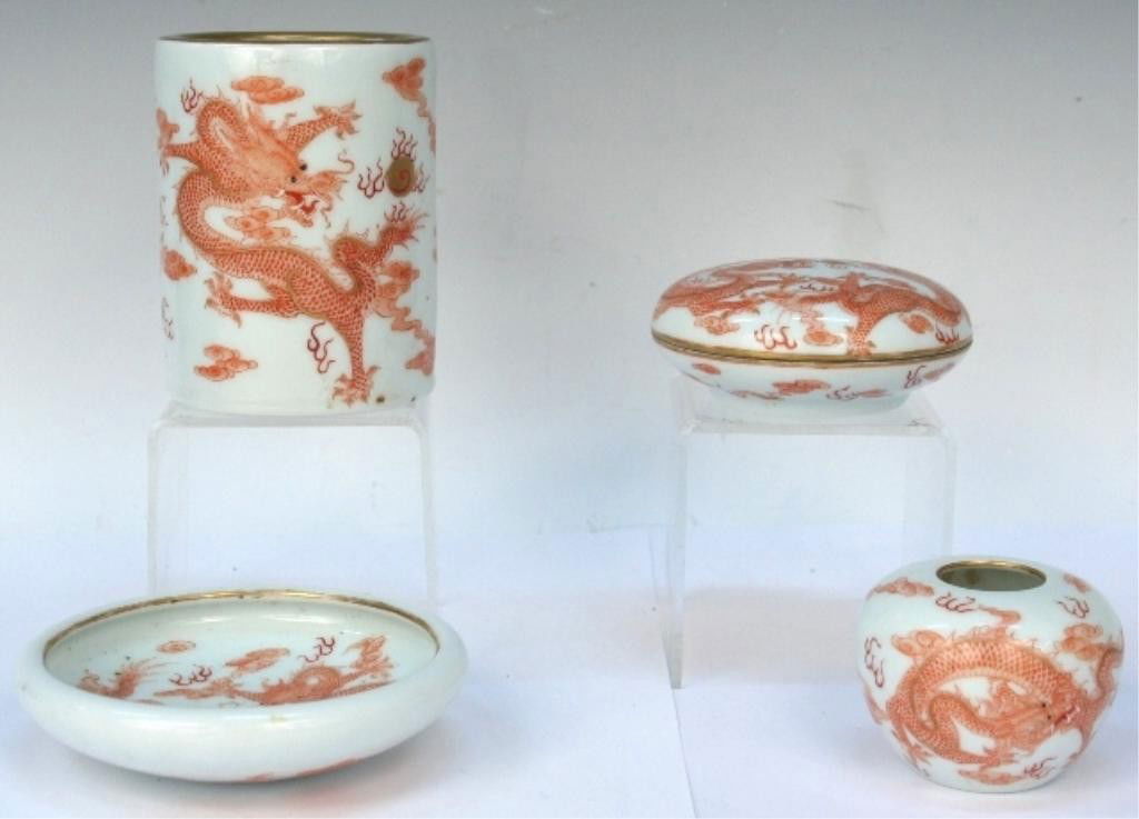 4 Piece Porcelain Chinese Scholar's Set: Scholar's set of four pieces with dragon motif and gilding, porcelain, China; Guangxu marks on bottoms. Dimensions: Brushpot 4"H x 3" diameter; brush washer 1-1/8"H x 4-1/2" diameter; jar 2"H x 2-1/2"