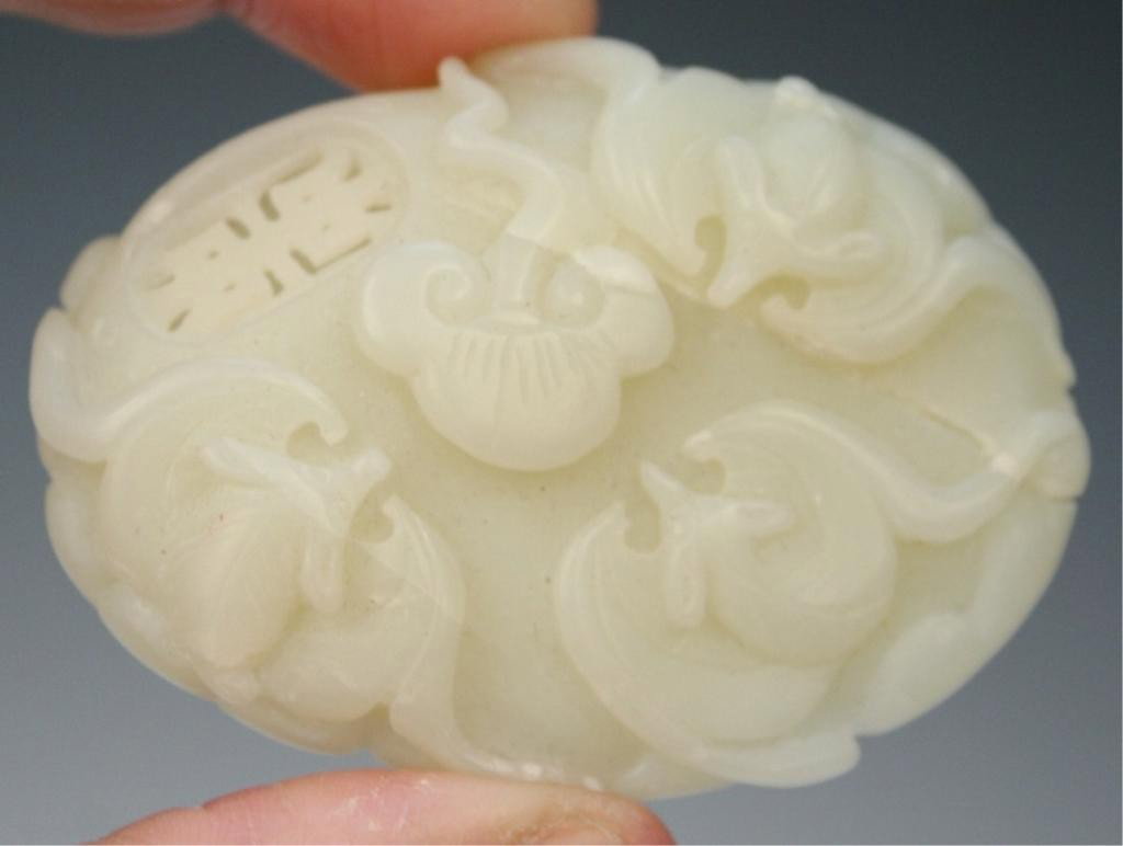 Chinese Carved White Jade Bats and Lotus Pendant: Carved white jade pendant with bats and lotus, China; unmarked. Dimensions: 2-3/8"L x 1-3/4"W x 1/2"D