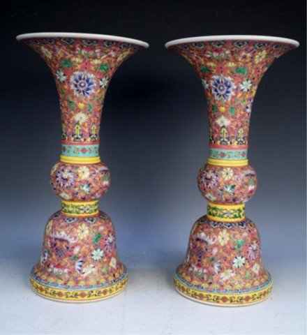 Pair of Chinese Famille Rose Beaker Vases 20th C.: Pair of famille rose beaker vases with rose ground and floral motif, porcelain, China, twentieth century; Qianlong mark on each. Dimensions: Each 14-7/8"H x 7-1/2" diameter