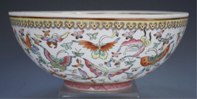 Chinese Famille Rose Egg Shell Bowl 20th Century: Famille rose egg shell bowl with butterflies, dragon medallion on interior, China, twentieth century; Qianlong mark. Dimensions: 4"H x 9-1/2" diameter