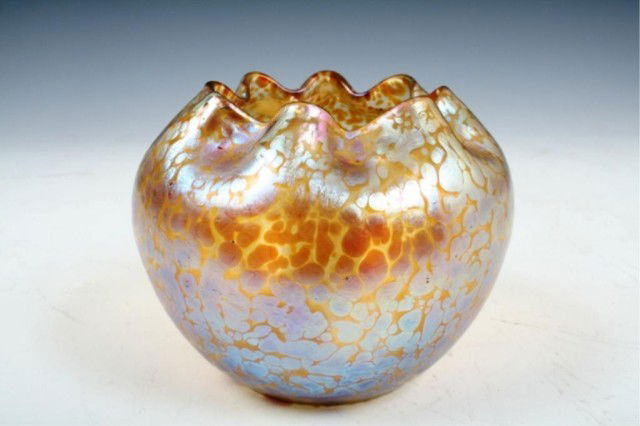Loetz Glass Vase with Oil-Drop Glaze: Glass vase decorated with oil-drop glaze manufactured in Bohemia by the Loetz glasswork. Features an irregular, "pie-crust" rim that appears finger-pinched. Dimensions: 4-1/2"H x 5-1/2" diameter