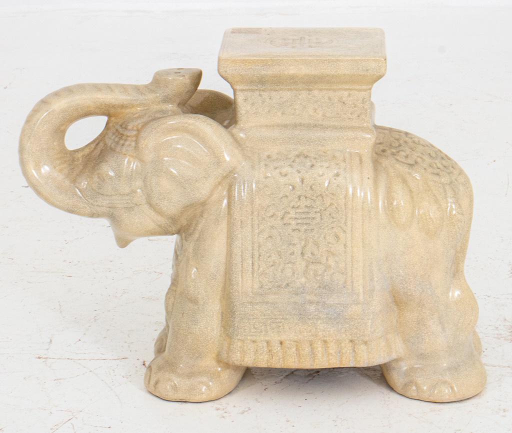 Elephant Cream Ceramic Stand: Off-white crackle glaze pottery of an elephant forming side table or stand; 17" H x 21" W x 8.5"D.