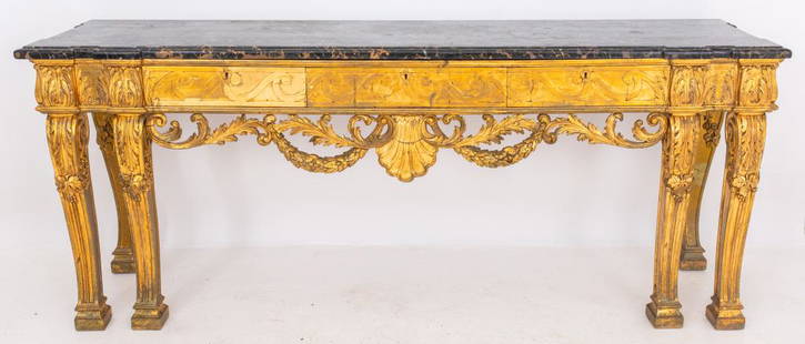 George II Style Console, Manner of William Kent: George II style giltwood console in the manner of William Kent (British, 1685 - 1748), rectangular, with shaped rectangular Nero Portoro marble slab top above three short drawers concealed by a Vitruv