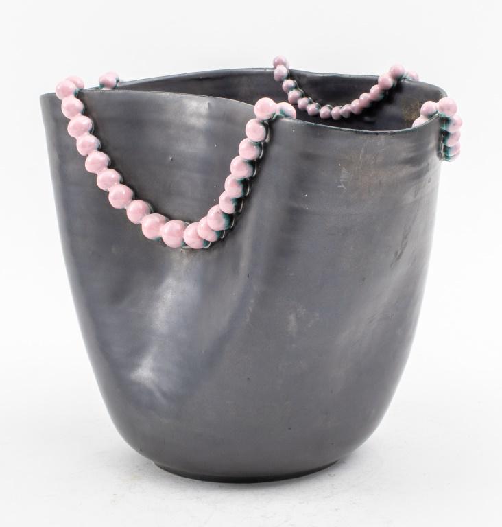 Cardo D'Oro Italian Surrealist Ceramic Pearls Vase: Il Cardo d'Oro Italian Surrealist glazed ceramic undulating vase in gun metal black with an applied string of delicate pink ceramic pearls, circa 1940s, with makers mark on the bottom. 9" H x 12" W x 