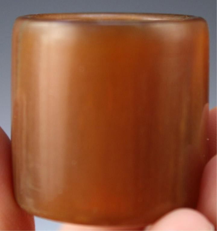 Chinese Carved Horn Archer's Ring: Carved translucent archer's ring, horn, China; unmarked. Dimensions: 1-1/4"H x 1-1/8" diameter; 7/8" interior diameter