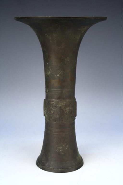 Chinese Bronze Gu Vessel Ming Dynasty: Gu vessel with low relief band, bronze, China, probably Ming Dynasty (1368-1644); marked on bottom. Dimensions: 11-1/2"H x 6-3/4" diameter at mouth