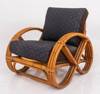 Paul Frankl Style Bamboo Pretzel-Arm Lounge Chair: Bamboo pretzel-arm lounge chair in the manner of Paul Frankl, with pretzel-shaped bent-bamboo arms and with upholstered back and seat cushions. 31" H x 27" W 30" D x 16" seat