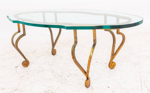 Maison Ramsay Style Gilded Wrought Iron Low Table: Hollywood Regency gilded wrought iron low coffee or cocktail table, 1950s, after the model by Jean Charles Moreux (French, 1889 - 1956) for Maison Ramsay, with shaped oval top above conforming lacquer