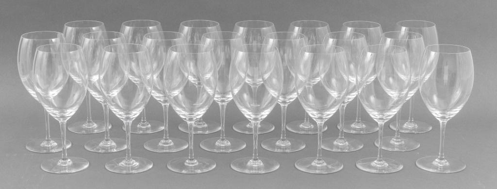 Baccarat Crystal Red Wine Glasses, 21: Twenty-one Baccarat crystal red wine glasses, each marked "Baccarat France" to undersides. Each cup: 9.5" H x 4" diameter. Provenance: Property from an Upper East Side townhouse.