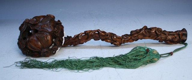 Chinese Boxwood Ruyi Scepter 19th C.: Ruyi scepter with pomegranate and foliage motif and hanging green tassels, boxwood, China, nineteenth century; unmarked. Dimensions:14" L x 4" W (top), with tassel: 29" L
