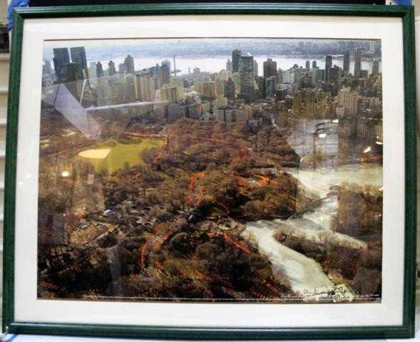 Poster Christo & Jeanne-Claude's The Gates Signed: Poster created from Wolfgang Volz aerial photograph of the instillation The Gates by Christo and Jeanne-Claude in NYC Central Park, framed; signed by Christo and Jeanne-Claude. Dimensions: overall 38-