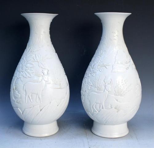 Chinese Pair White Porcelain Wang Bingrong Vases: Pair of white-glazed Wang Bingrong-type vases with floral and animal decoration, porcelain, China; each marked on bottom. Dimensions: each approximately 13-1/2"H x 6-1/2" diameter