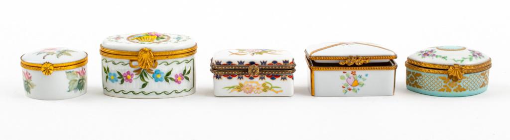 Limoges Porcelain Floral Trinket Boxes, 5: Five Limoges porcelain floral trinket / decorative boxes, made in France, two made by Rochard, one made by Chamant. Largest: 1.5" H x 3" W x 2" D.