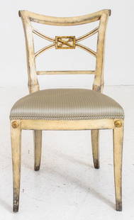 Hollywood Regency Parcel Gilt & Gesso Side Chair: Hollywood Regency parcel gilt and gessoed side chair, in the manner of Syrie Maugham, with scrolling shaped crest rail above a shaped x-stretcher centering a gilded trophy depicting an arrow and quive