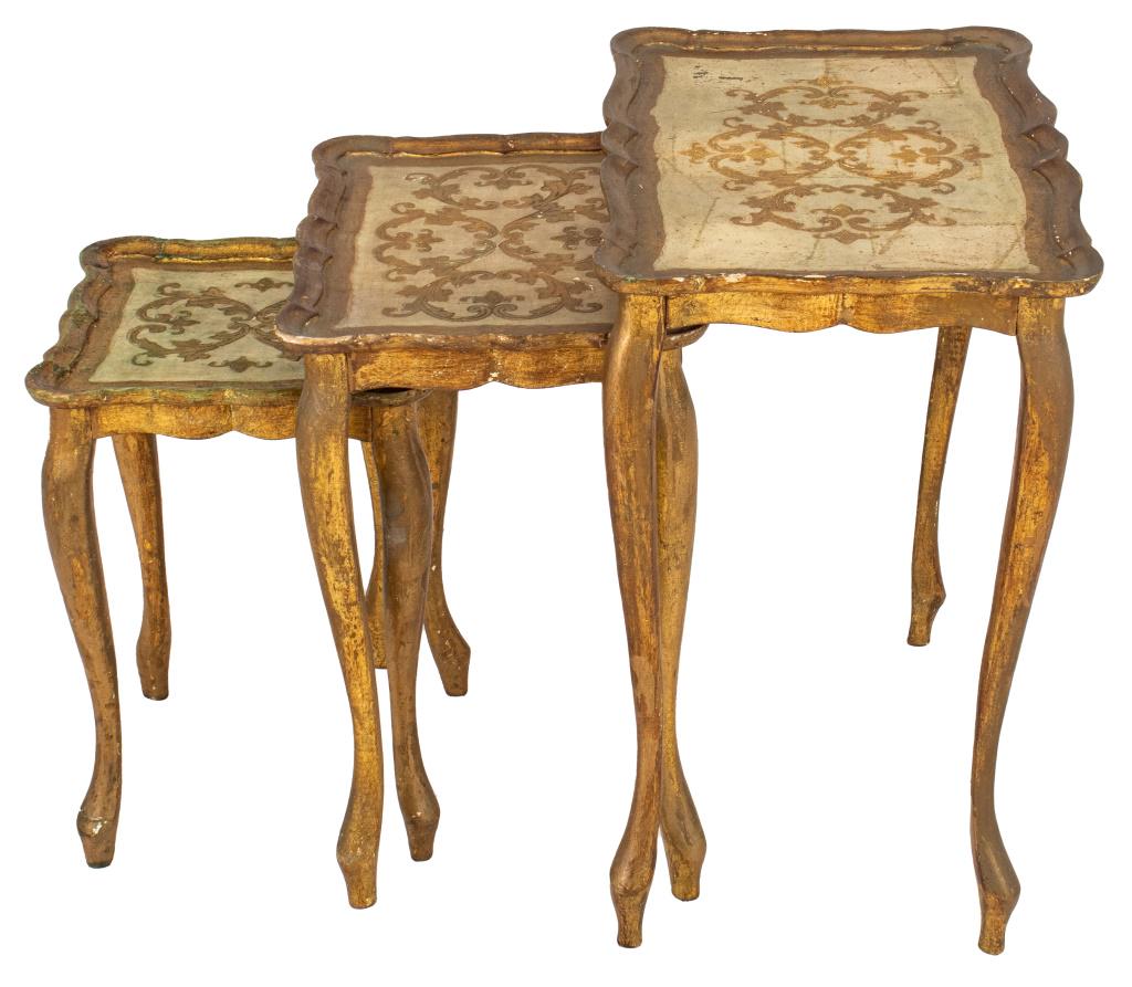 Venetian Rococo Style Nesting Tables, 3: Set of Venetian Rococo Style gold and white painted nesting tables, three, shaped rectangular tops with gold decoration and borders above gilded cabriole legs on modified volute feet. 23" H x 22" W x