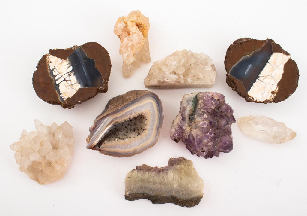 Various Minerals, Group of 8: Group of eight various collectible minerals comprising three half geodes and five pieces of amethist quartz or crystal rock. Largest: 3.5" H x 2.5" x 1.5" D.