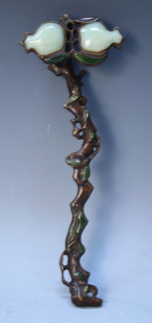 Chinese Bronze Ruyi Scepter with Jade Inlays: Ruyi scepter with vine-shaped handle, bronze with jade inlays, China; unmarked. Dimensions: approximately 1-5/8"H x 11"L x 4"W