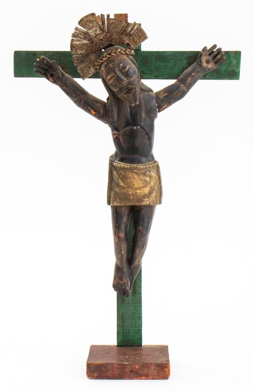 Latin American Folkloric Devotional Sculpture: Latin American, possibly Colombian folkloric or naive devotional sculpture of the crucifixion, depicting the Savior in polychrome wood with hammered and woven tin mounts. 17.5" H x 11" W